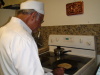 Even Dasturji gets into the act of cooking rotlis!