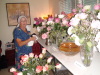 Flower girl Jo Ann cleaning and refreshing the Muktad Tables