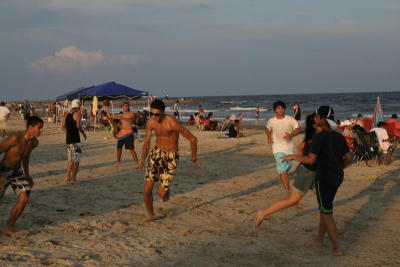 A scene of the football game on the beach!